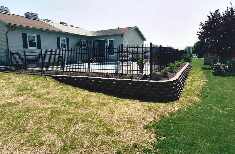 photo of a pool-side retaining wall