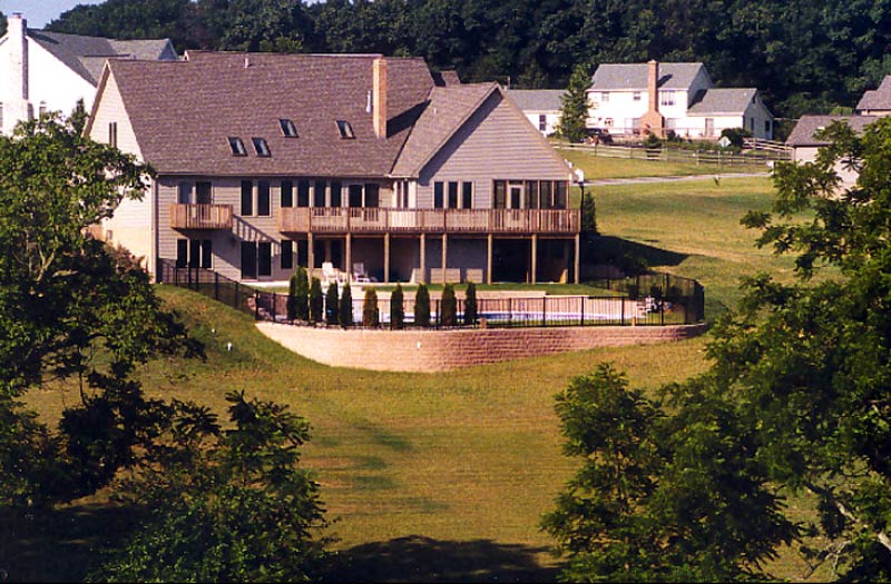 photo of a pool-side retaining wall